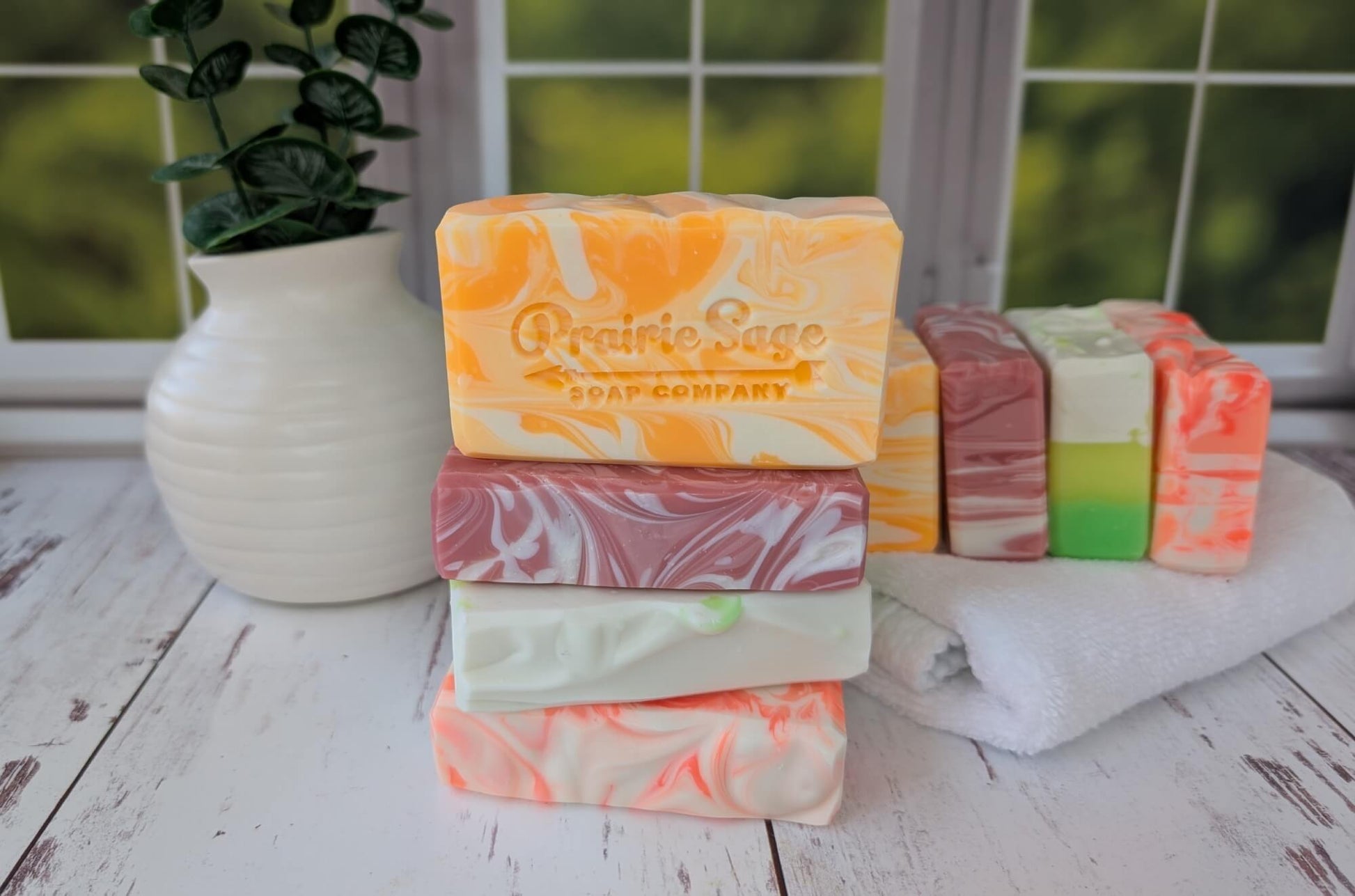 All four mango oasis box soaps sitting on a table