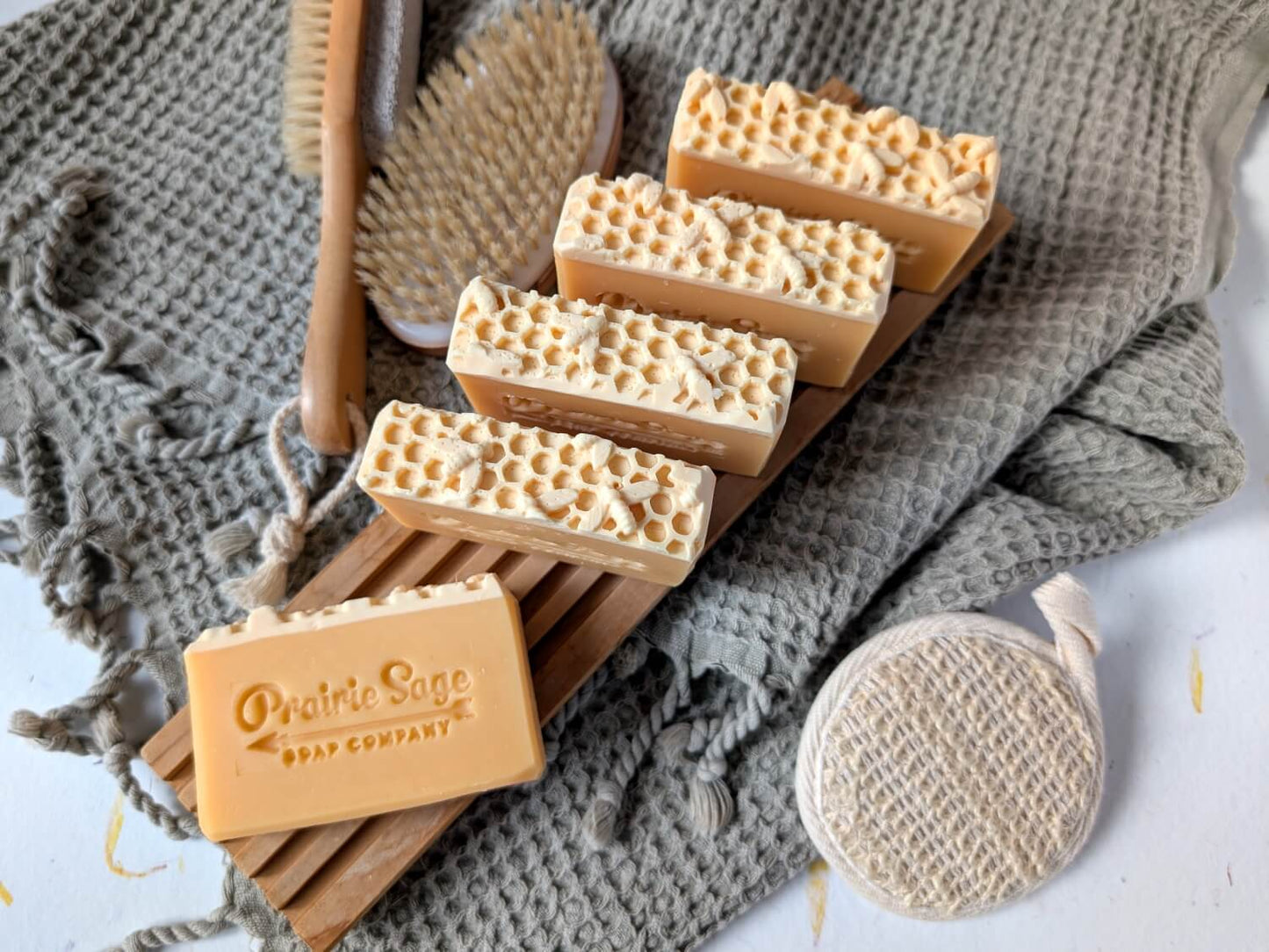 Apricot and Honey handmade soap on a wooden tablet.