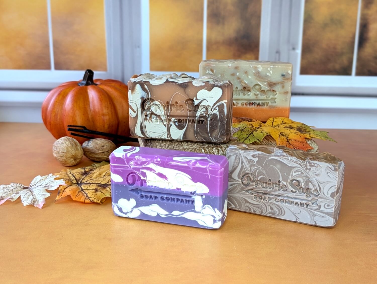 All four handmade soaps in the Cozy Days fall soap box sitting together.