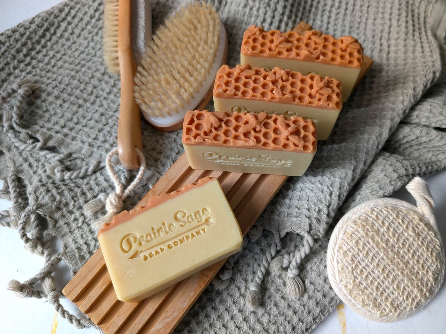 Honey Butter and Shea handmade soap on a wooden tablet.