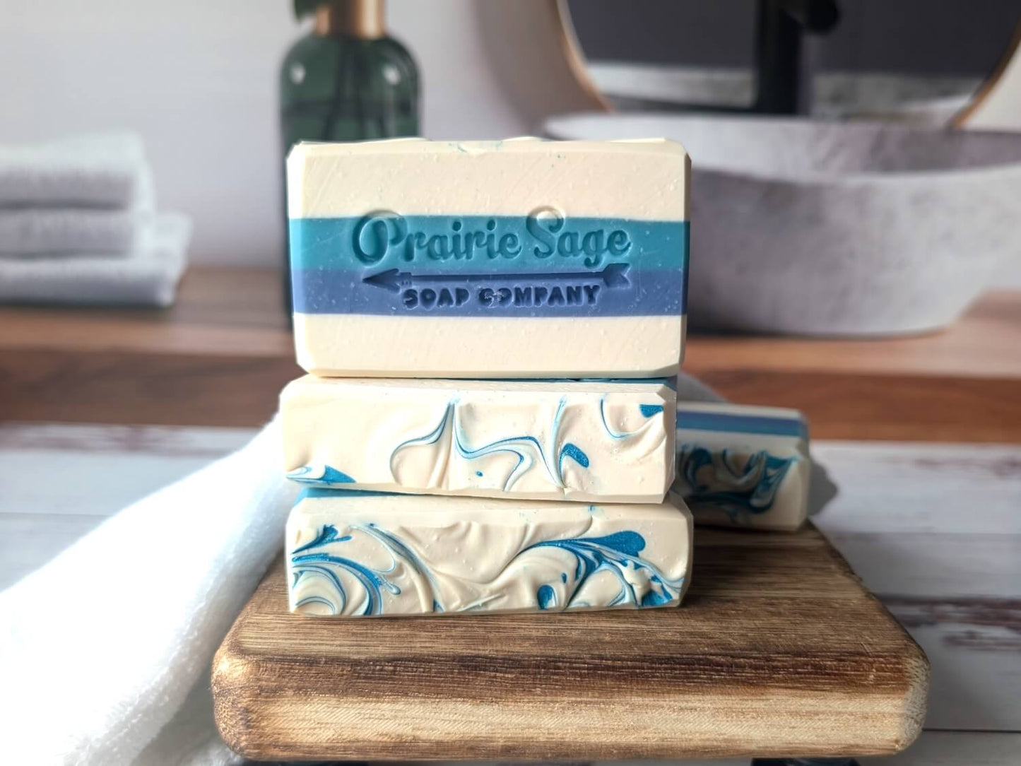 Lumberjack scented handmade soap stacked on a wooden board.