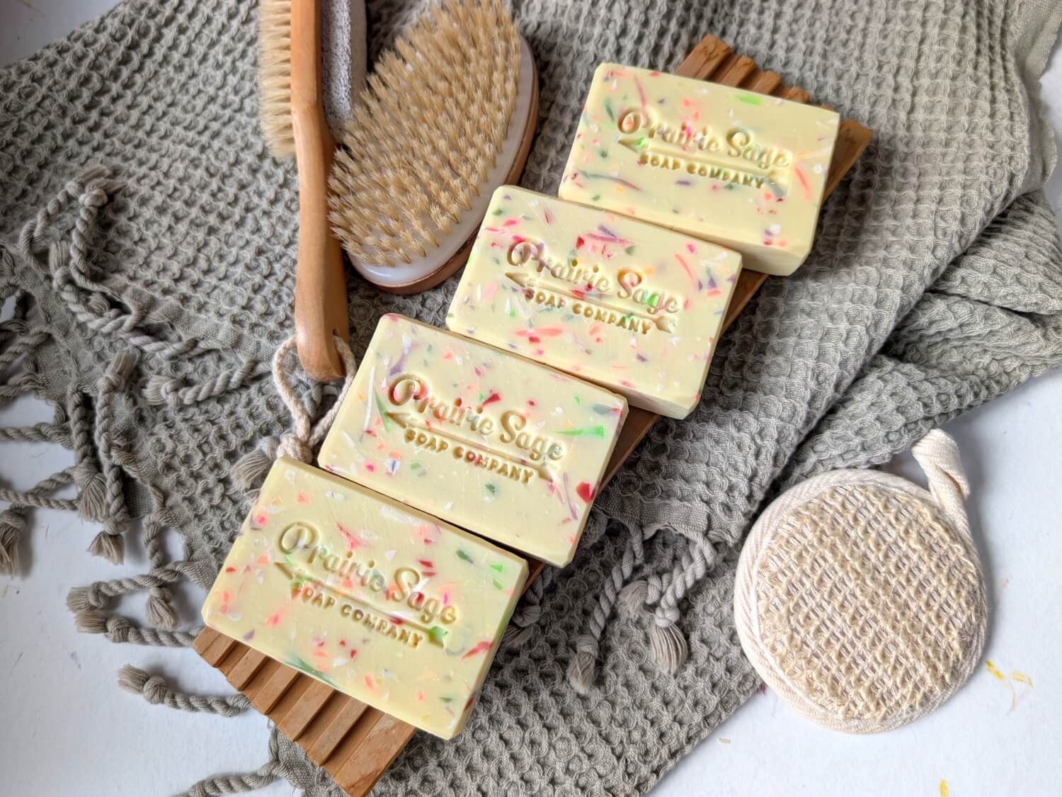 Wildflower and Honey handmade soap on a wooden tablet.